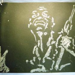 african soldier depicted on black paper with white sand and glue